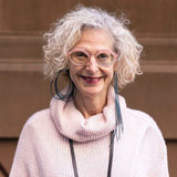 woman wearing a dark teal asymmetric rubber earrings