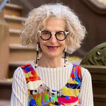 woman wearing a black and white tube and cube earrings