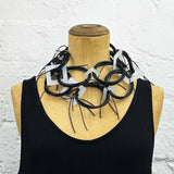Long chaotic necklace recycled materials black and white