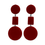 red dangle earrings on a white background