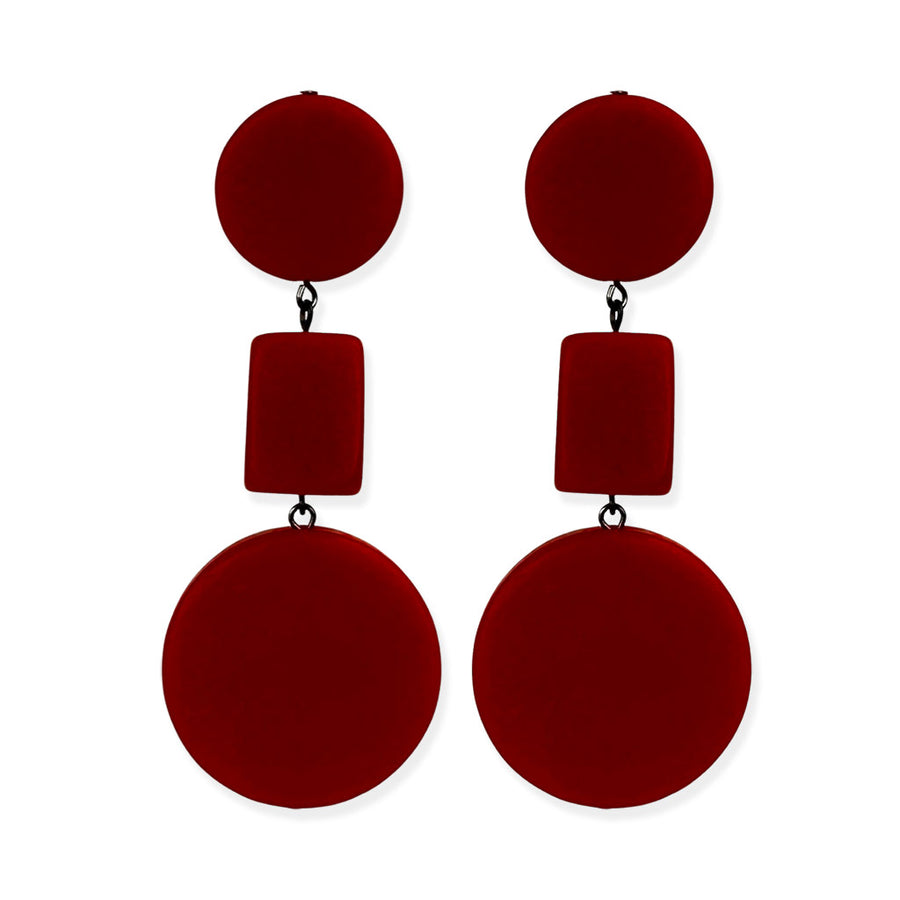 red dangle earrings on a white background