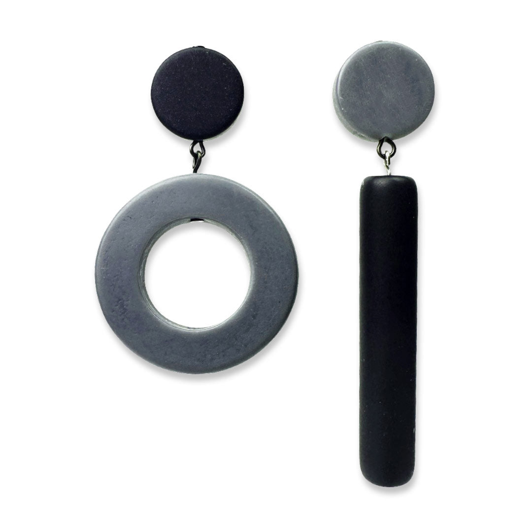 Asymmetrical black and dark grey dot and dash earrings on a white background