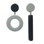 Asymmetrical black and grey dot and dash earrings on a white background