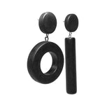 Asymmetrical black dot and dash earrings on a white background