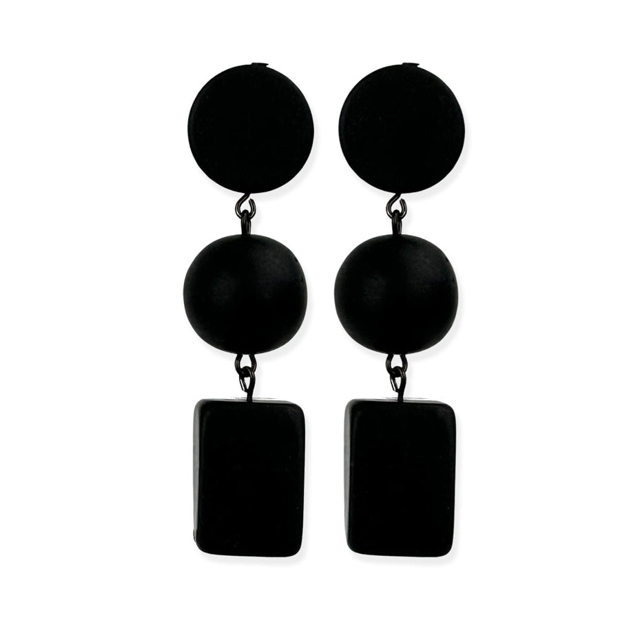black dangling earrings on a white background