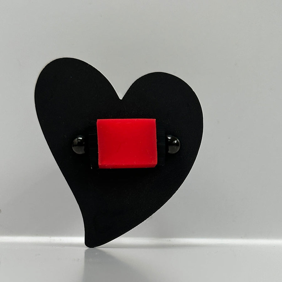 Large heart shaped chunky black and red ring