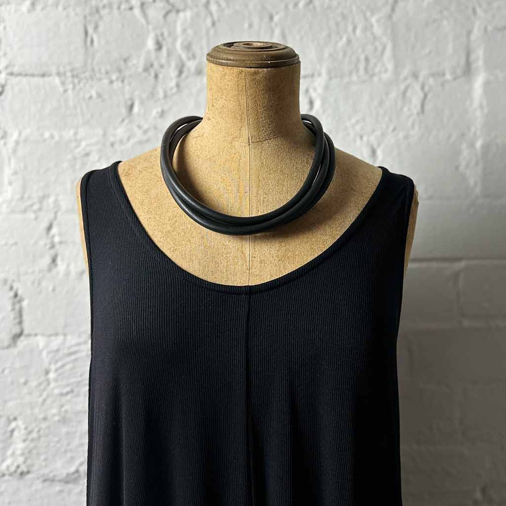 black rubber, modern necklace on mannequin