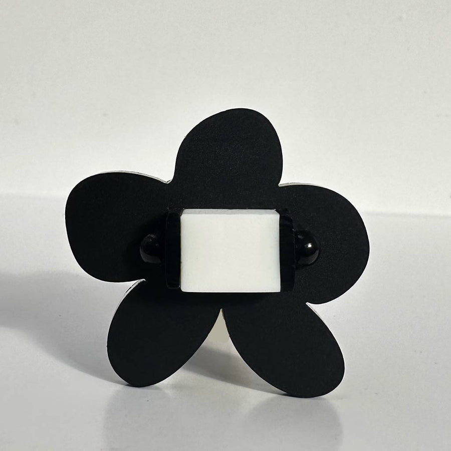 flower shaped black chunky ring with white centre
