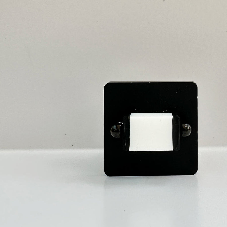 black chunky square ring with white square inset centre