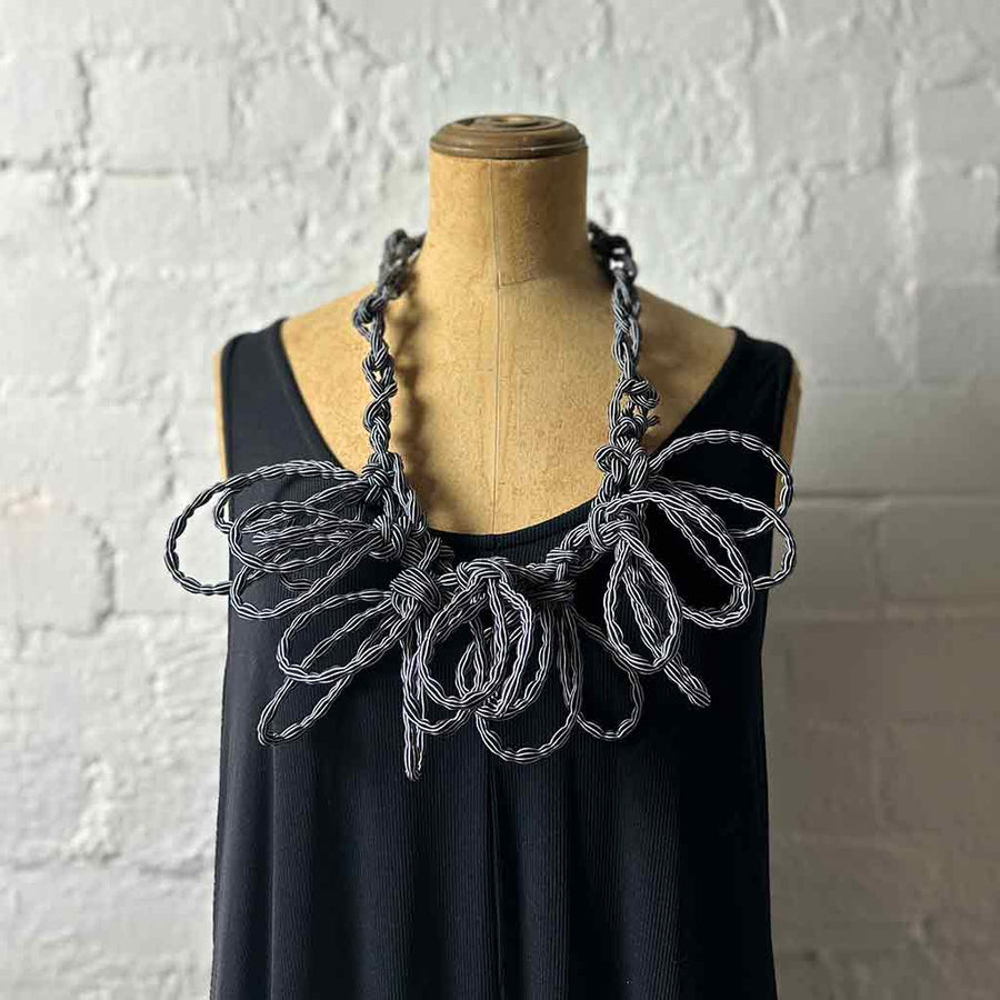 black and white stripe textile necklace on a mannequin