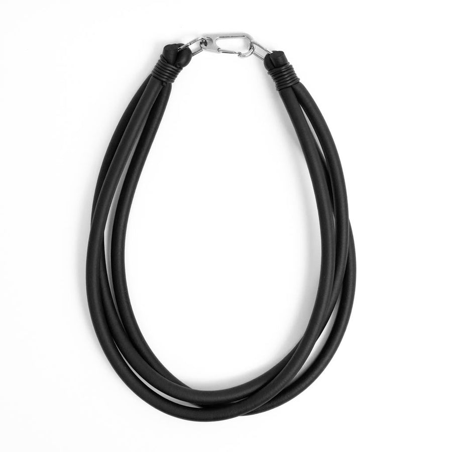 black triple strand rubber, modern necklace by Frank Ideas on a white background
