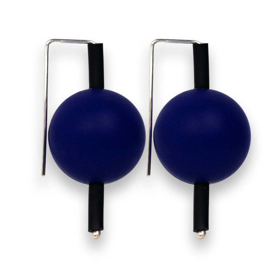 blue supersized earrings on a white background