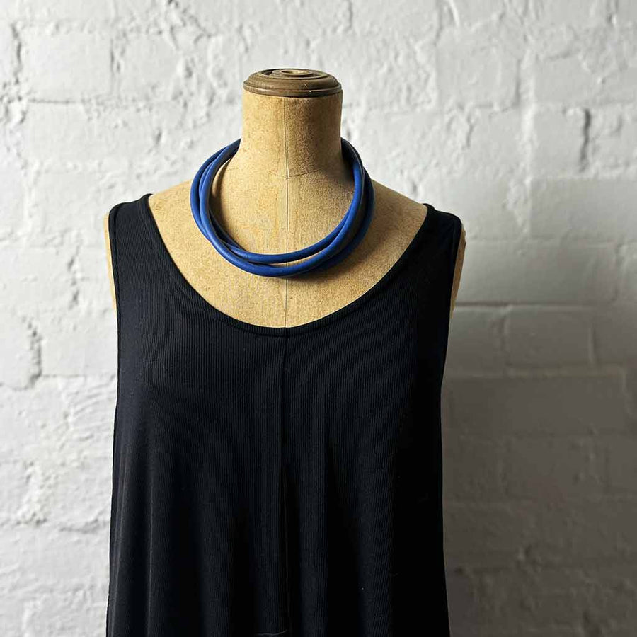 blue triple strand rubber, modern necklace on mannequin