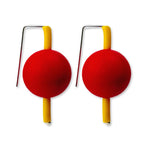 yellow and red supersized earrings on a white background