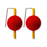 yellow and red supersized earrings on a white background