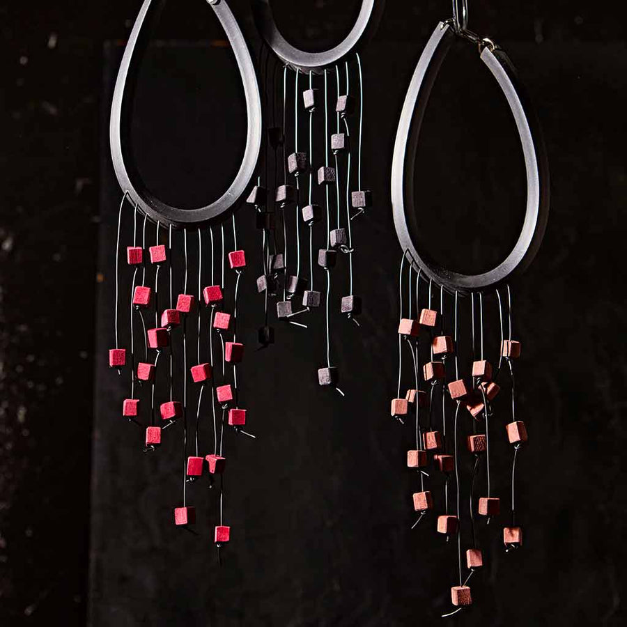 Statement necklaces on a black backdrop