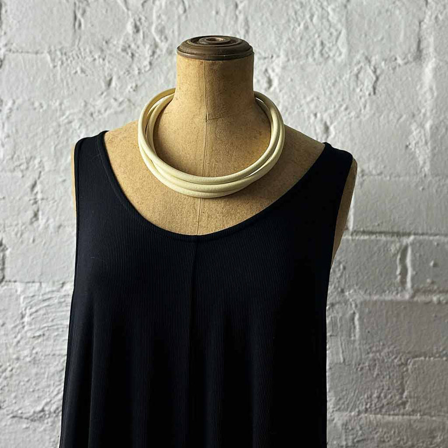cream triple strand rubber on neck mannequin, modern necklace by Frank Ideas