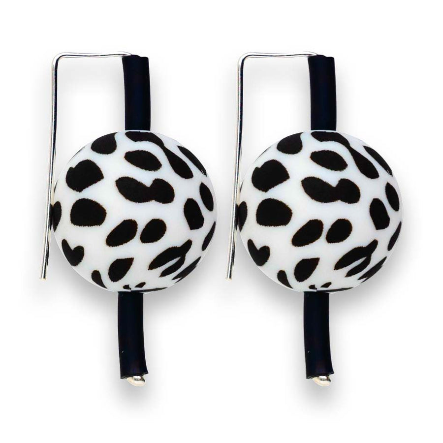 black and white dalmatian-patterned supersized earrings on a white background