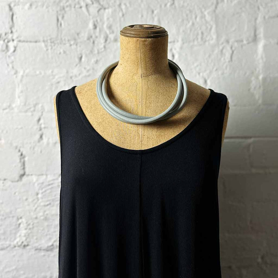 grey triple strand rubber, modern necklace on mannequin
