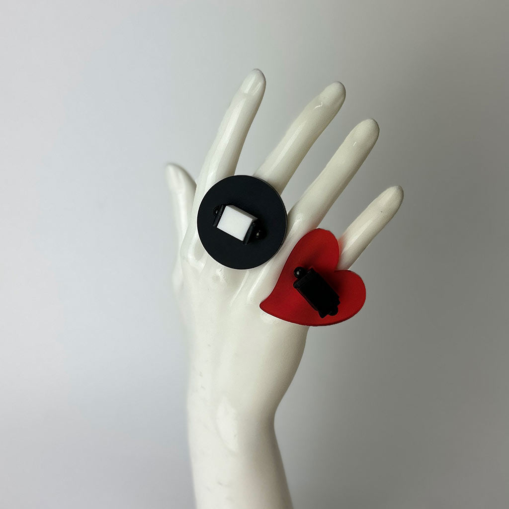 mannequin hand showing two chunky perspex rings