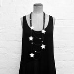 Rubber jewellery: white star necklace on a mannequin