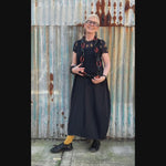 video of owner of Frank Ideas wearing black and tan recycled rubber necklace