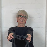 supersized earrings and necklace demonstration in a video