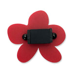 Red flower-shaped ring with a black centre.
