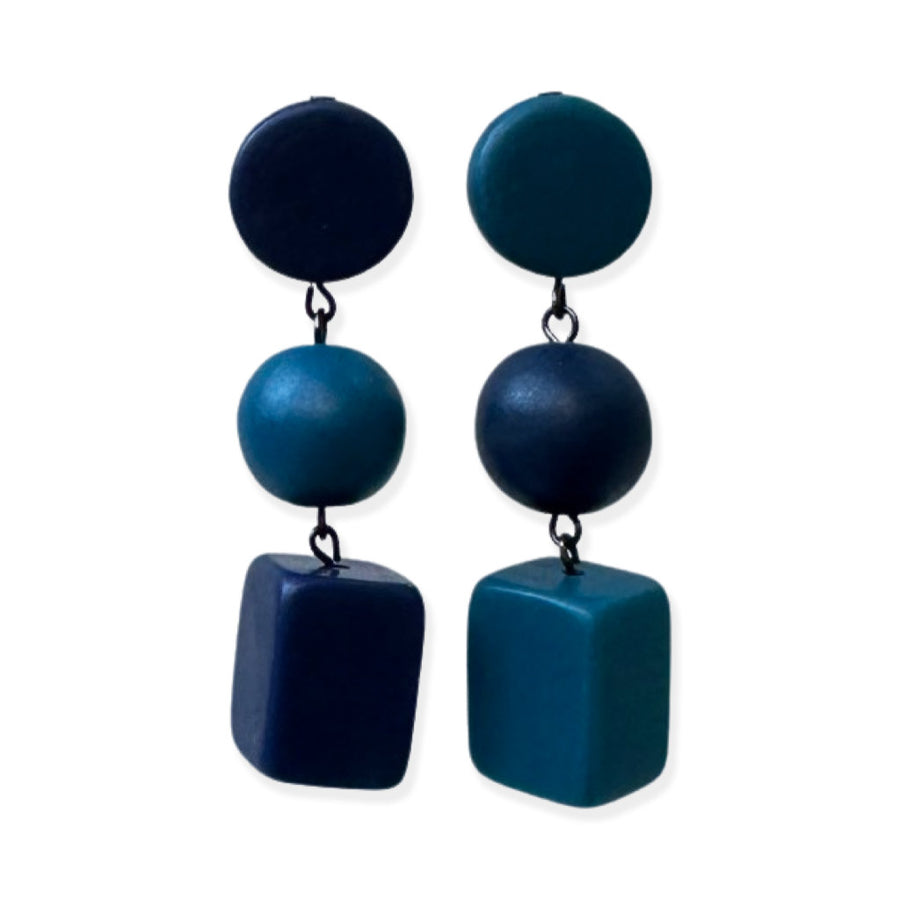 teal-blue dangling earrings on a white background