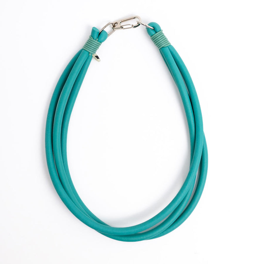 teal triple strand rubber, modern necklace by Frank Ideas on a white background