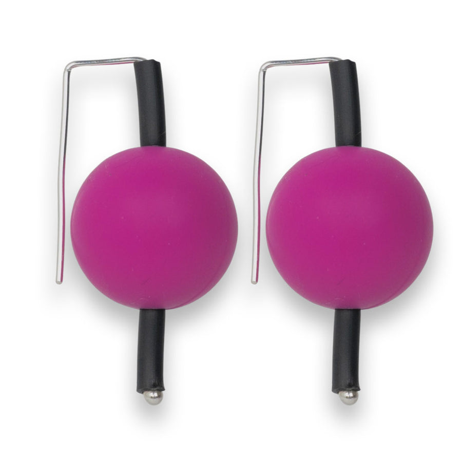 pink supersized earrings on a white background
