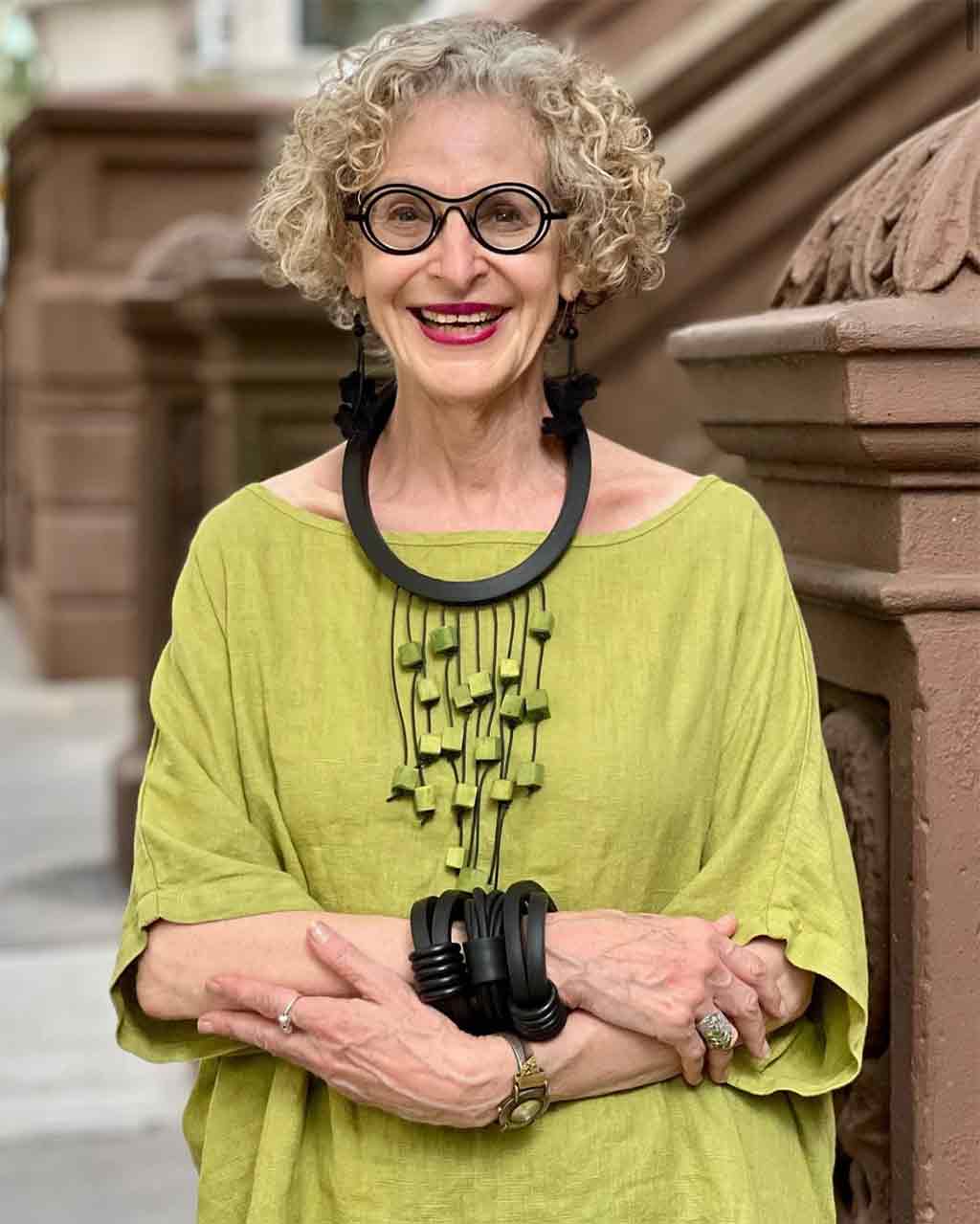 Statement Necklace on a older female with bobbed curly blonde hair
