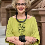 Statement Necklace on a older female with bobbed curly blonde hair