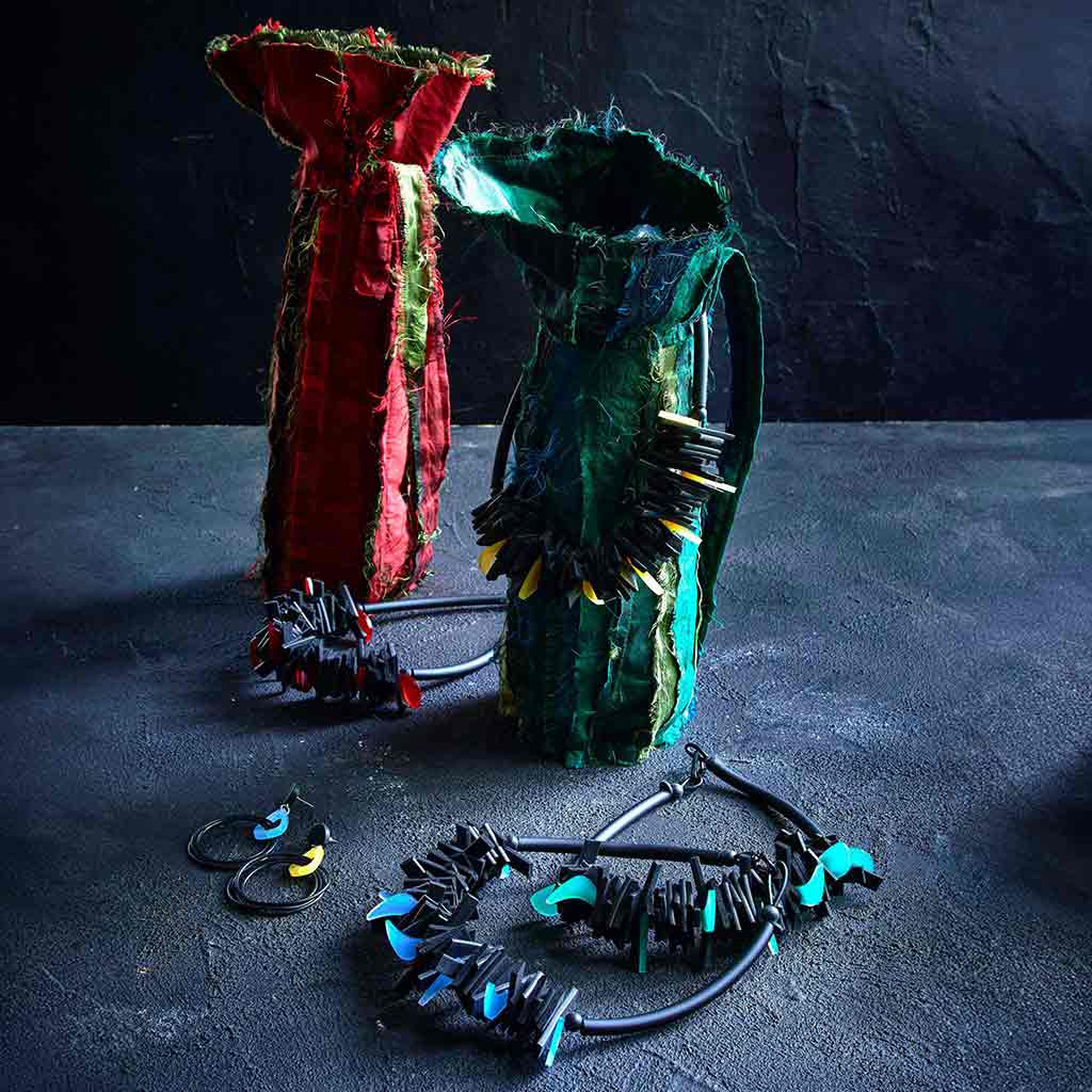 Recycled Rubber and Perspex Necklace on a dark background