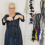 woman wearing a black knotted rubber necklace demonstration in a video