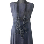 long black rubber necklace on a mannequin