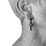 Rubber earrings made with sterling silver. Bold, fun design.