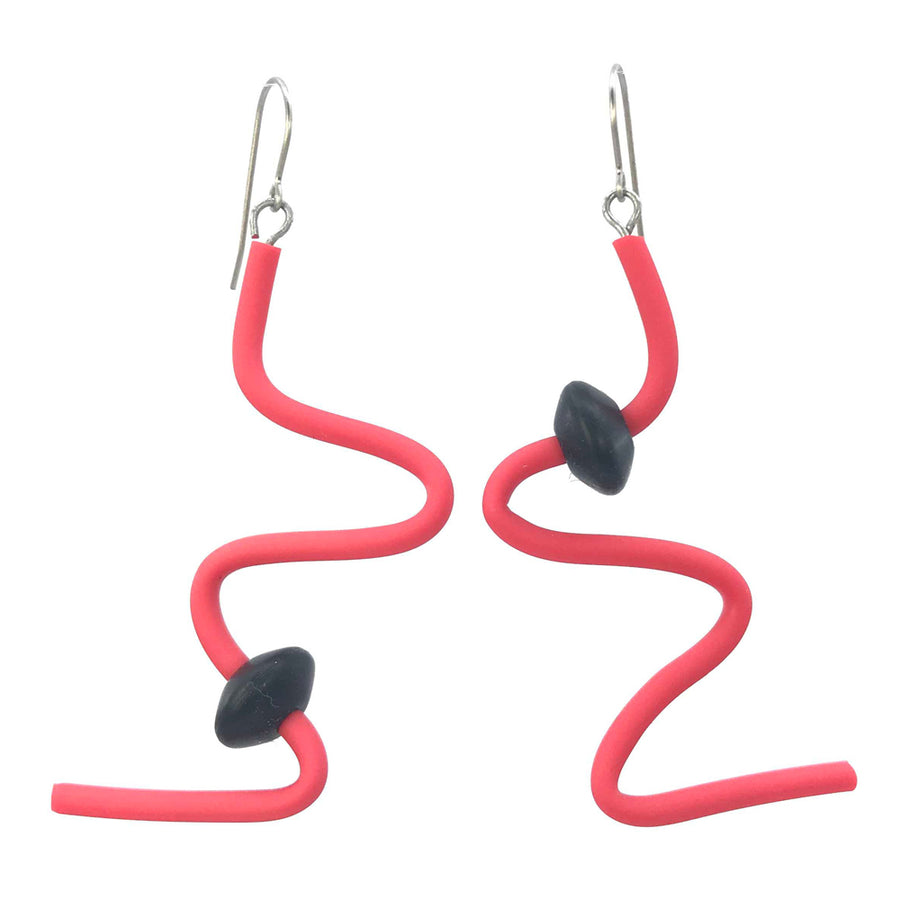 red squiggle earrings with black beads on a white background
