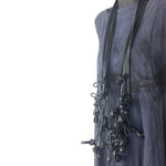 long black rubber necklace on a mannequin