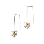 silver earrings with round silver disks on a white background