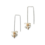 silver earrings with round silver disks on a white background