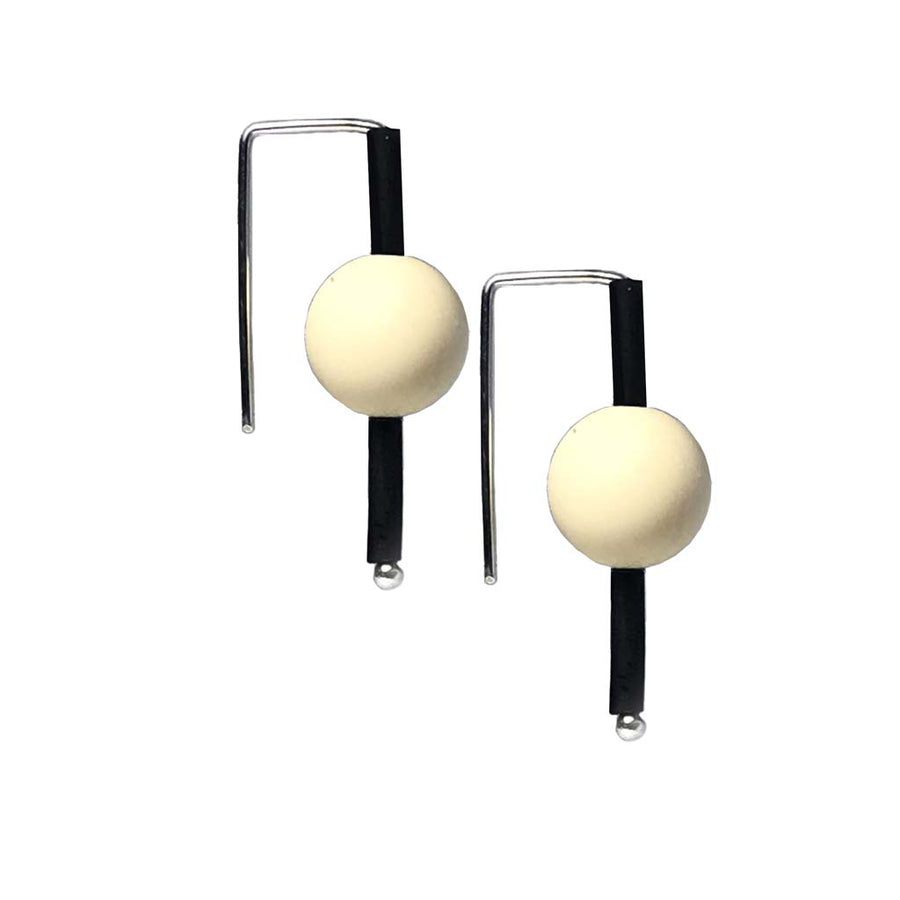 Cream rubber earrings made with sterling silver. Bold, fun design.