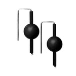 Black rubber earrings made with sterling silver. Bold, fun design.