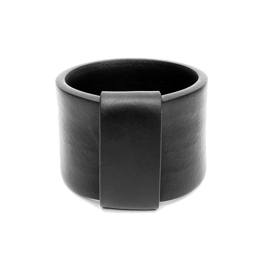 wide black bangle on a white background