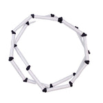 black and white rod necklace on a white background