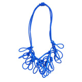 blue statement rubber necklace on a white background