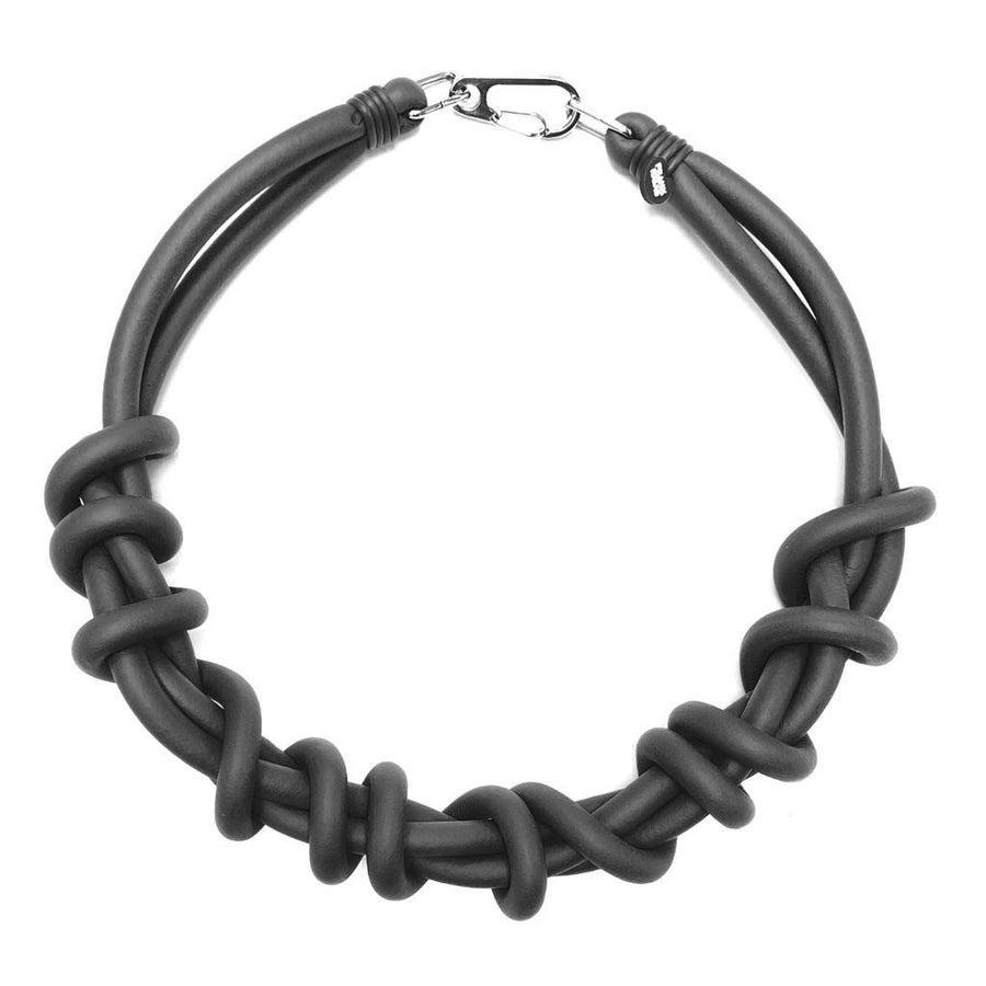 black twist necklace on a white background