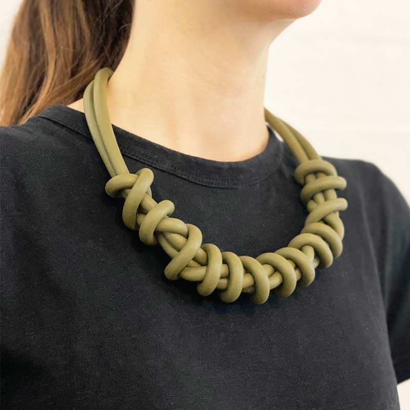 woman wearing green/olive twist necklace