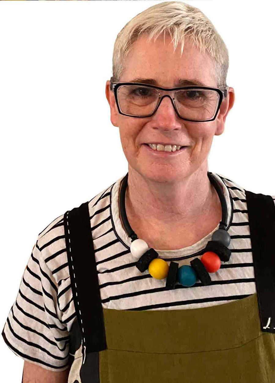 rowan shaw the designer for Frank Ideas wearing the short chunky, multi colored resin necklace