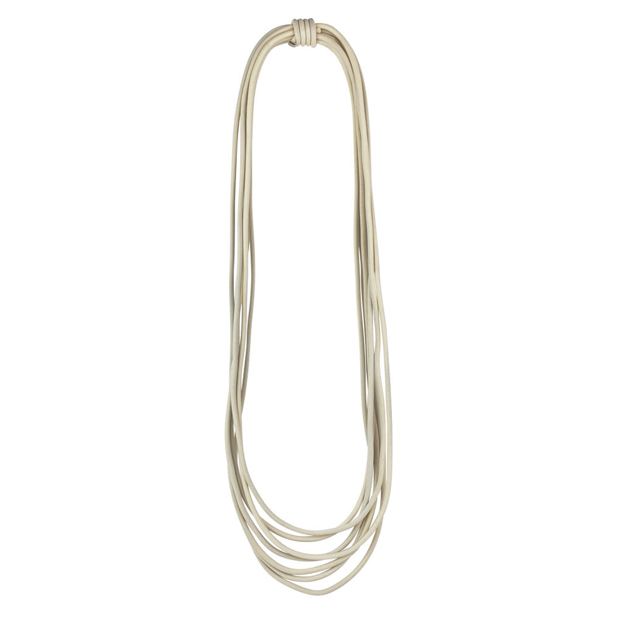 long cream rubber necklace on a white background